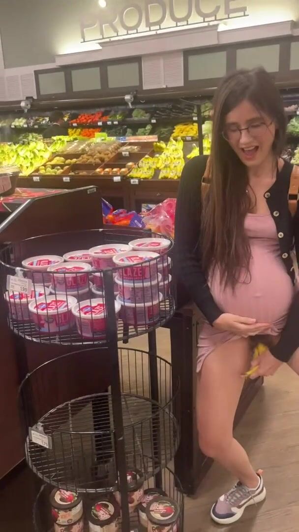 Pregnant women taking banana in her cunt in a supermarket
