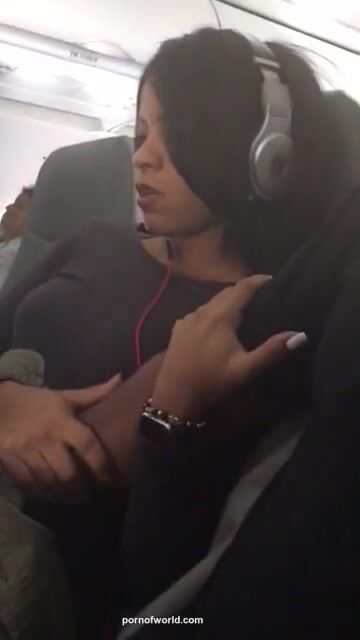 Fingering his gal on the Plane