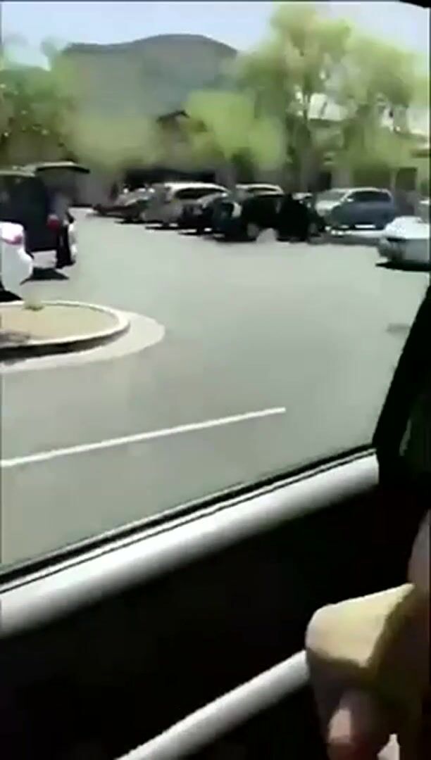 Deepthroating a dildo in a public parking lot