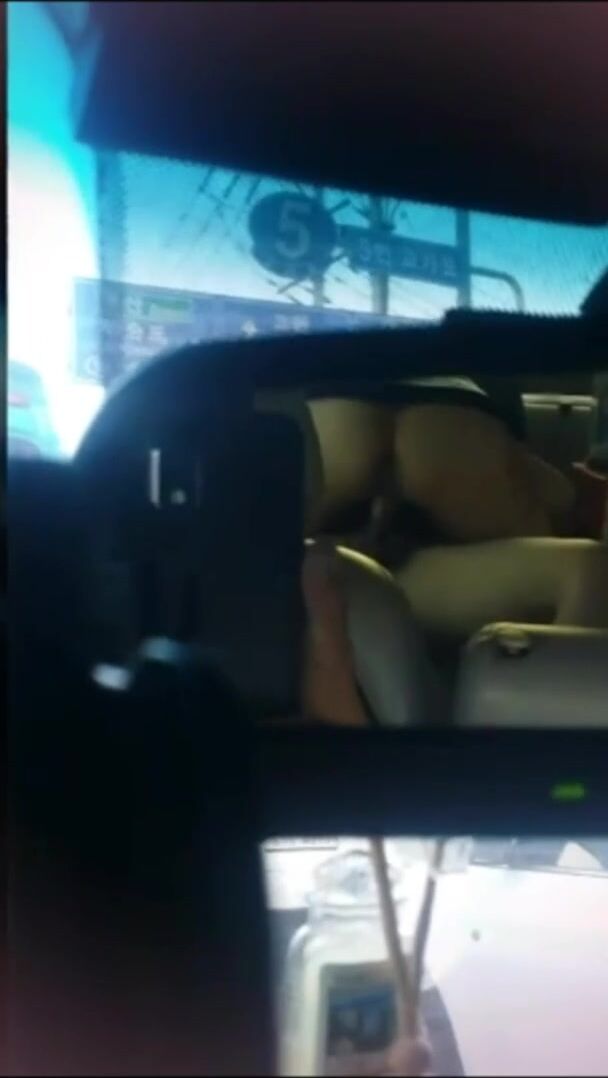 in the backseat of a taxi during a traffic jam