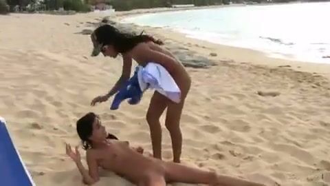 This girl must be really thirsty. The other nice girl is helping her out by quenching her thirst