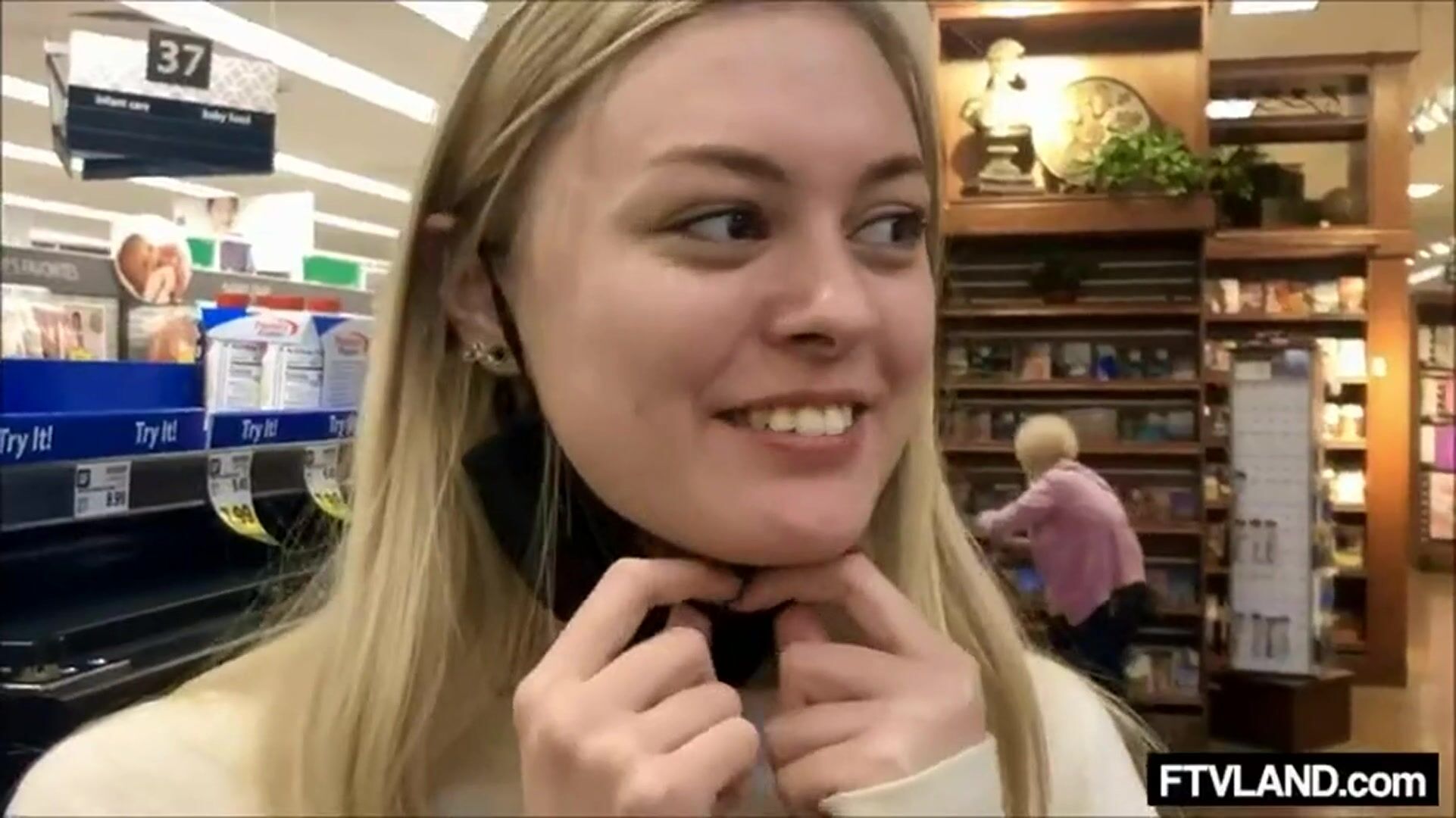 Happy Embarrassed Girl Flashing in a Store